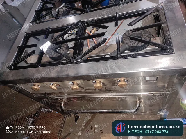 The burner top and controls of the commercial gas cooker, January 2022
