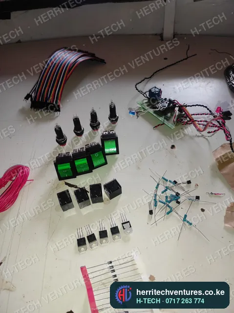 Relays, switches and indicator parts laid out for a batch of H-TECH controllers, June 2022