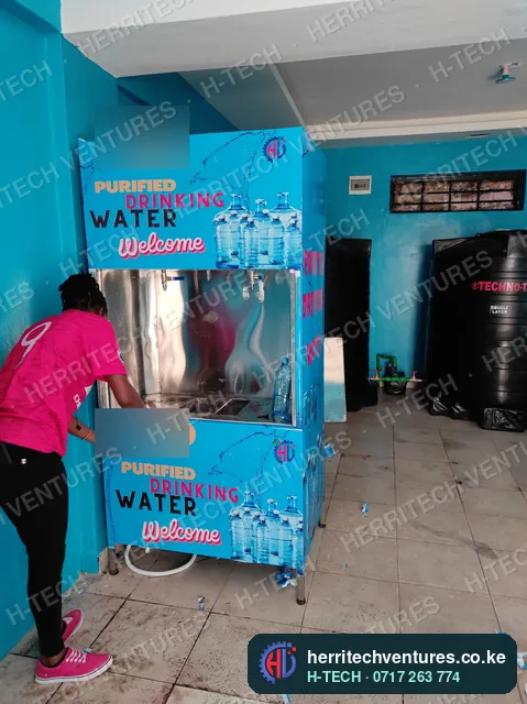 Fitting a water refilling station in a shop, September 2022