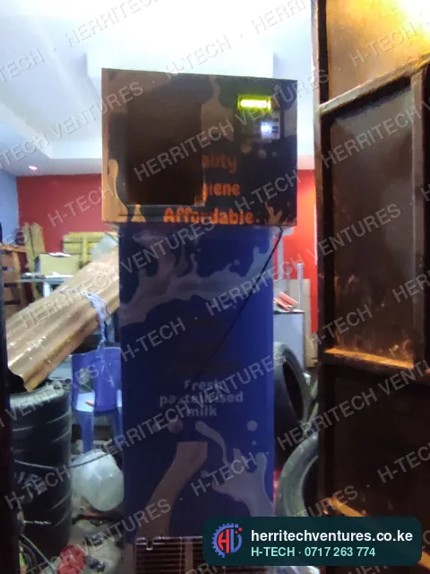 The milk ATM's top cabinet with controller and dispensing bay, August 2022
