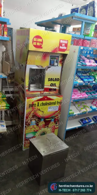 An H-TECH salad oil ATM in a supermarket, with its stainless drip box, January 2019
