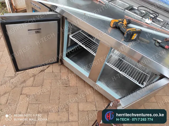 A stainless steel refrigerated counter under fabrication, April 2022