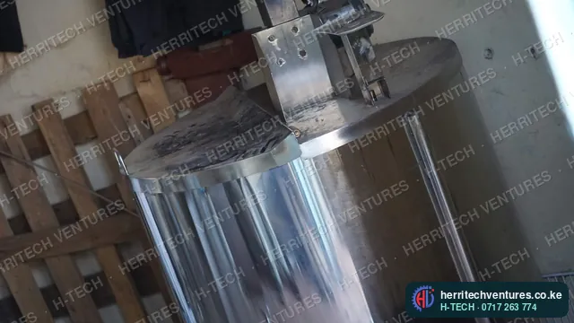 A stainless steel tank with a motor-driven stirrer, January 2019